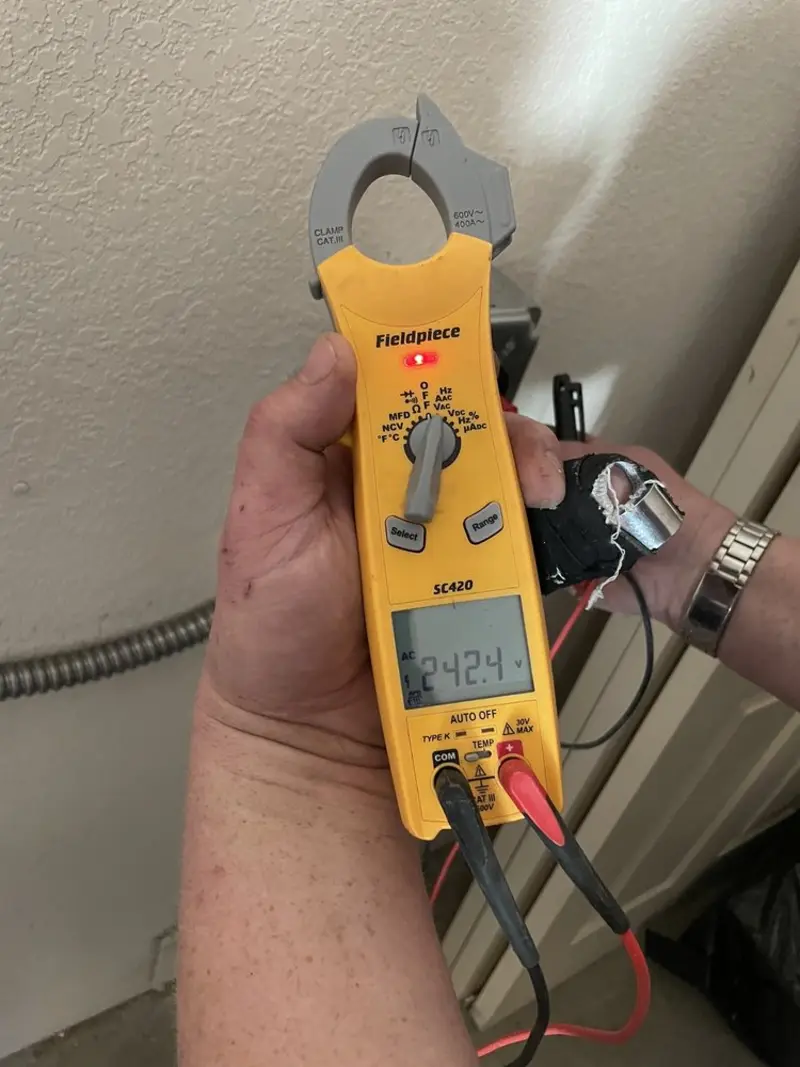 Voltage testing with clamp meter during Recessed Lighting Installation in North Shore